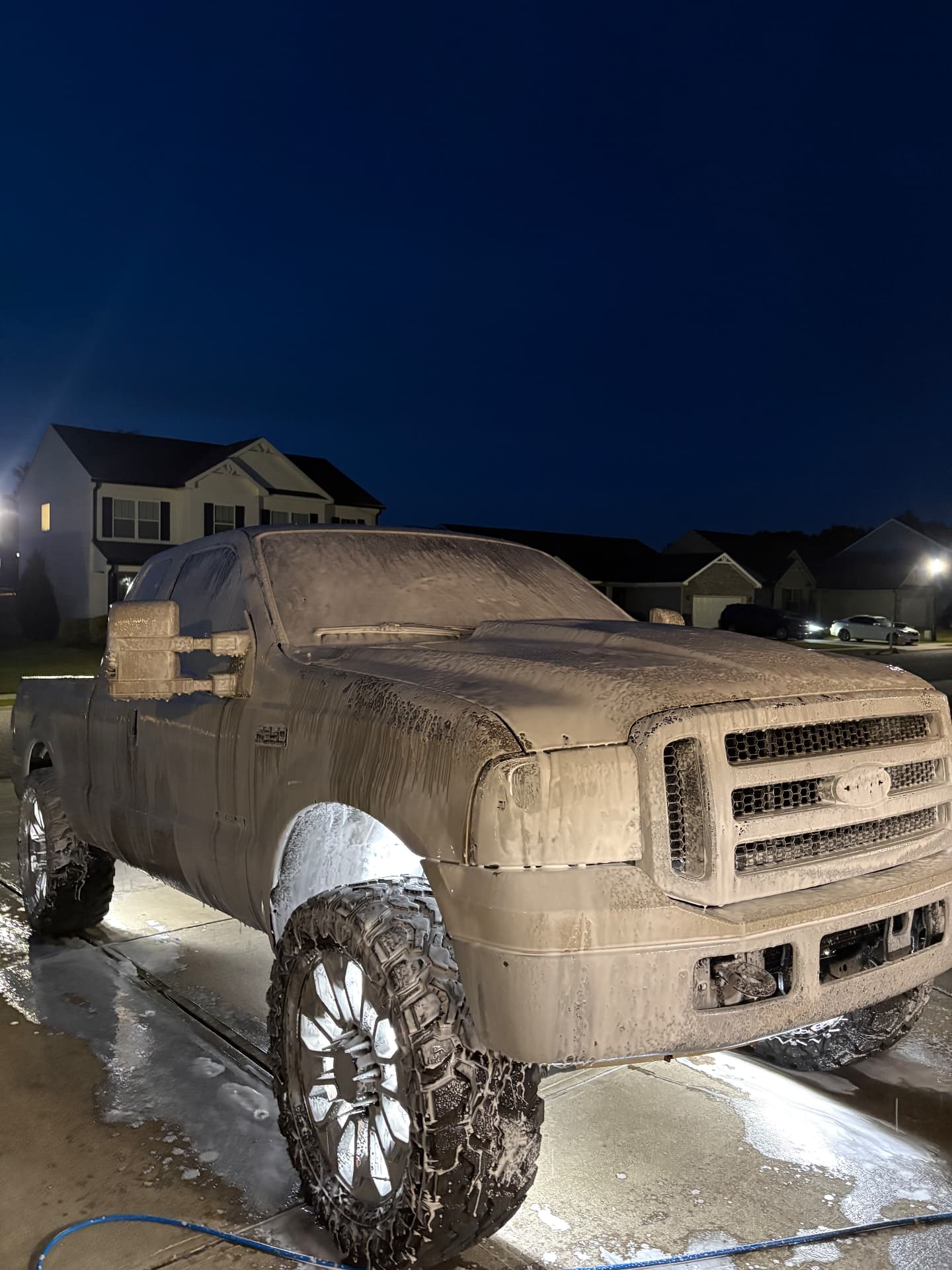 Ford truck getting a thorough evening foam wash by Southern Shine